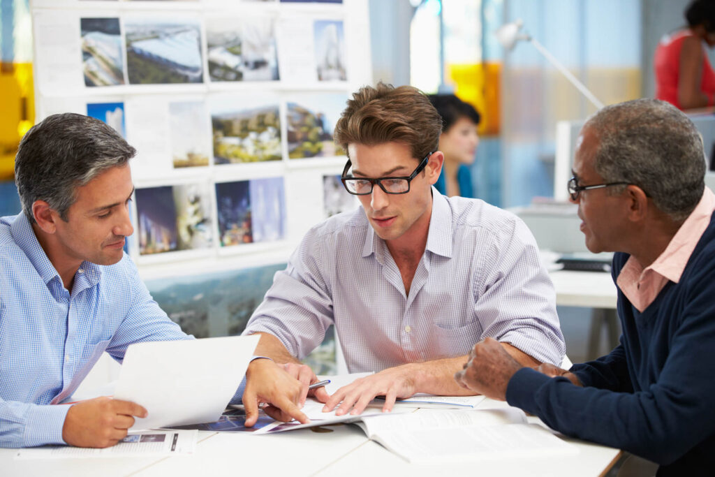 group of men meeting in creative office